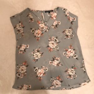 Am selling a light blue shirt with flowers on it.